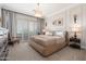 Serene bedroom features neutral tones, plantation shutters, and elegant furnishings at 15240 N Clubgate Dr # 160, Scottsdale, AZ 85254