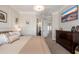 Comfortable bedroom with neutral walls, crown molding, and an ensuite bathroom at 15240 N Clubgate Dr # 160, Scottsdale, AZ 85254