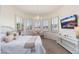 Bright bedroom with a sitting area, neutral decor, and a chandelier at 15240 N Clubgate Dr # 160, Scottsdale, AZ 85254