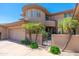 Beautiful home exterior boasts unique architecture, desert landscaping and gated entrance at 15240 N Clubgate Dr # 160, Scottsdale, AZ 85254