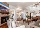 Open concept living room offers views to kitchen, dining, and staircase at 15240 N Clubgate Dr # 160, Scottsdale, AZ 85254