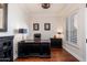 Home office with dark wooden desk, dark wooden floors, crown molding, and shuttered windows at 15240 N Clubgate Dr # 160, Scottsdale, AZ 85254