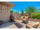 Charming outdoor patio with comfortable seating, a perfect space for relaxation and entertaining at 15240 N Clubgate Dr # 160, Scottsdale, AZ 85254