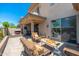 Spacious patio with outdoor fireplace, dining area, and seamless indoor-outdoor living transition with the sliding glass door at 15240 N Clubgate Dr # 160, Scottsdale, AZ 85254