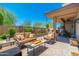 Inviting backyard patio features a cozy seating area and lush landscaping, creating a serene outdoor oasis at 15240 N Clubgate Dr # 160, Scottsdale, AZ 85254