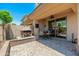 Covered patio featuring a brick fireplace and an outdoor dining space is perfect for enjoying the outdoors at 15240 N Clubgate Dr # 160, Scottsdale, AZ 85254