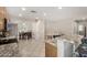 Spacious kitchen with granite countertops and stainless steel appliances that opens to the dining area at 16219 W Yucatan Dr, Surprise, AZ 85379