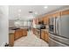 Open kitchen with granite countertops, stainless steel appliances, and tile flooring at 16219 W Yucatan Dr, Surprise, AZ 85379