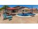 Enjoy poolside lounging in this backyard with lush greenery, patio, and sparkling pool, perfect for relaxing or entertaining at 16219 W Yucatan Dr, Surprise, AZ 85379