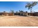 The home's exterior in the backyard features a covered patio and generous space at 1628 E Sunland Ave, Phoenix, AZ 85040