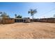 Expansive backyard featuring a covered patio and privacy fence, perfect for outdoor entertaining and relaxation at 1628 E Sunland Ave, Phoenix, AZ 85040