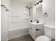Clean bathroom with a tub, shower, and modern fixtures at 1628 E Sunland Ave, Phoenix, AZ 85040