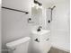 Clean bathroom featuring a modern vanity, matte black fixtures, and shower at 1628 E Sunland Ave, Phoenix, AZ 85040