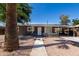 Charming single-story home with a well-maintained gravel yard and covered parking area at 1628 E Sunland Ave, Phoenix, AZ 85040