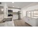 Bright kitchen features granite countertops, stainless steel appliances, and ample cabinet space at 1628 E Sunland Ave, Phoenix, AZ 85040