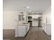 Modern kitchen with white cabinets, stainless steel appliances, and granite countertops at 1628 E Sunland Ave, Phoenix, AZ 85040