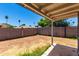 Backyard features gravel landscaping, a block wall, and a covered patio at 1733 W Surrey Ave, Phoenix, AZ 85029