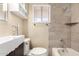 Bathroom features a modern vanity, stylish tile, and updated fixtures at 1733 W Surrey Ave, Phoenix, AZ 85029