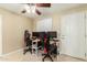 Bedroom featuring a ceiling fan, a window and two desk and gaming chairs at 1733 W Surrey Ave, Phoenix, AZ 85029
