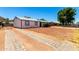This is a nice ranch-style home that boasts a long driveway, xeriscape landscaping, and mountain views at 1733 W Surrey Ave, Phoenix, AZ 85029
