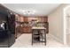 Well-appointed kitchen featuring stainless steel appliances, granite counters, and a kitchen island at 1733 W Surrey Ave, Phoenix, AZ 85029