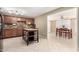 Spacious kitchen featuring stone countertops, updated appliances, and direct access to the dining room at 1733 W Surrey Ave, Phoenix, AZ 85029