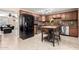 Modern kitchen with stainless steel appliances, granite countertops, and a convenient kitchen island at 1733 W Surrey Ave, Phoenix, AZ 85029