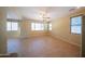 Dining room with tile flooring, a ceiling fan, and ample natural light from large windows at 17433 W Holland Ln, Surprise, AZ 85388