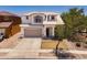 Charming two-story home featuring desert landscaping, a two-car garage, and neutral color scheme at 17433 W Holland Ln, Surprise, AZ 85388