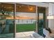 Scenic view of the backyard from the living room showcasing the outdoor landscaping at 17706 N Rosa Dr, Maricopa, AZ 85138