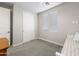 Cozy bedroom with neutral walls, carpet, and a large closet for ample storage at 17706 N Rosa Dr, Maricopa, AZ 85138