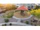 Overhead view of the neighborhood park featuring a playground, shade structure, and seating at 17706 N Rosa Dr, Maricopa, AZ 85138