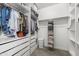 Spacious walk-in closet with custom shelving and ample storage for clothing and accessories at 17706 N Rosa Dr, Maricopa, AZ 85138