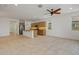 Open kitchen features a large island, stainless steel appliances, and recessed lighting at 18032 W Muirwood Dr, Goodyear, AZ 85338