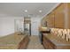 Modern kitchen design with granite countertops and stainless steel appliances at 18032 W Muirwood Dr, Goodyear, AZ 85338