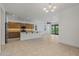 Bright kitchen with large island and stainless steel refrigerator at 18032 W Muirwood Dr, Goodyear, AZ 85338