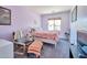 Bright bedroom featuring soft lavender walls, carpeting, and natural lighting at 18118 N Smith Dr, Maricopa, AZ 85139