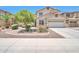 Charming two-story home featuring a desert landscaped front yard and a two-car garage at 18118 N Smith Dr, Maricopa, AZ 85139