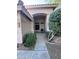 Inviting front entrance with a covered walkway and mature landscaping at 20609 N 57Th Dr, Glendale, AZ 85308