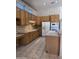 Bright kitchen with light wood cabinets and updated appliances at 20609 N 57Th Dr, Glendale, AZ 85308