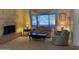 Comfortable living room with fireplace and a large window at 20609 N 57Th Dr, Glendale, AZ 85308