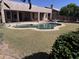 Backyard featuring a kidney-shaped pool with a diving board and spacious patio at 20609 N 57Th Dr, Glendale, AZ 85308