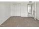 Bedroom with neutral carpet and closet with sliding doors at 2127 W Marco Polo Rd, Phoenix, AZ 85027