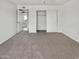 Bedroom with neutral carpet, featuring closet with sliding doors at 2127 W Marco Polo Rd, Phoenix, AZ 85027