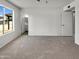 Bedroom with neutral carpet, leading to the bathroom at 2127 W Marco Polo Rd, Phoenix, AZ 85027