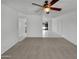 Expansive living area featuring tile flooring, a ceiling fan, and natural light, leading to various rooms in the home at 2127 W Marco Polo Rd, Phoenix, AZ 85027