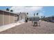 Inviting backyard featuring desert landscaping and a patio set for outdoor relaxation at 2400 E Baseline Ave # 197, Apache Junction, AZ 85119