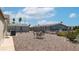Relaxing backyard featuring desert landscaping and a patio set for outdoor enjoyment at 2400 E Baseline Ave # 197, Apache Junction, AZ 85119