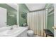 Cozy bathroom with a sink and vanity combination, toilet, and a shower with a curtain at 2400 E Baseline Ave # 197, Apache Junction, AZ 85119