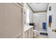 Bright bathroom with wooden cabinets, single sink, framed mirror, and glass shower stall at 2400 E Baseline Ave # 197, Apache Junction, AZ 85119